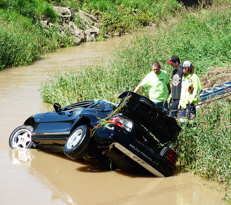 Vehicle retrieved from creek, no serious injuries